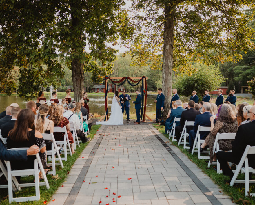 Bride and groom on lake in the Poconos, PA