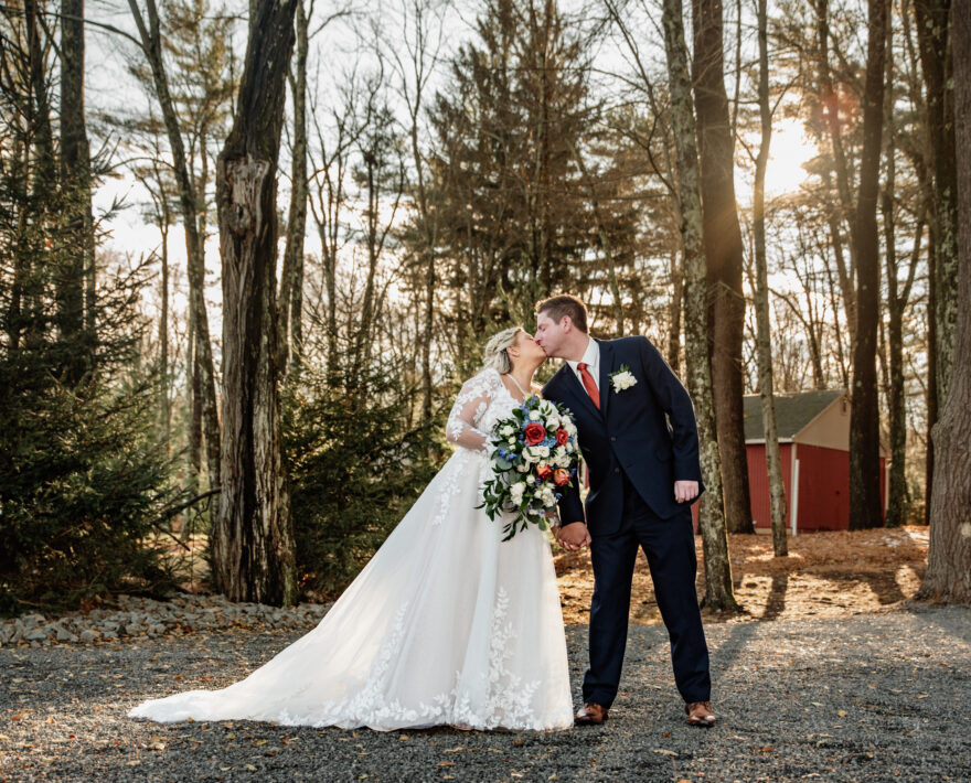 Couple walking through trees at Mount Pocono, PA wedding venue