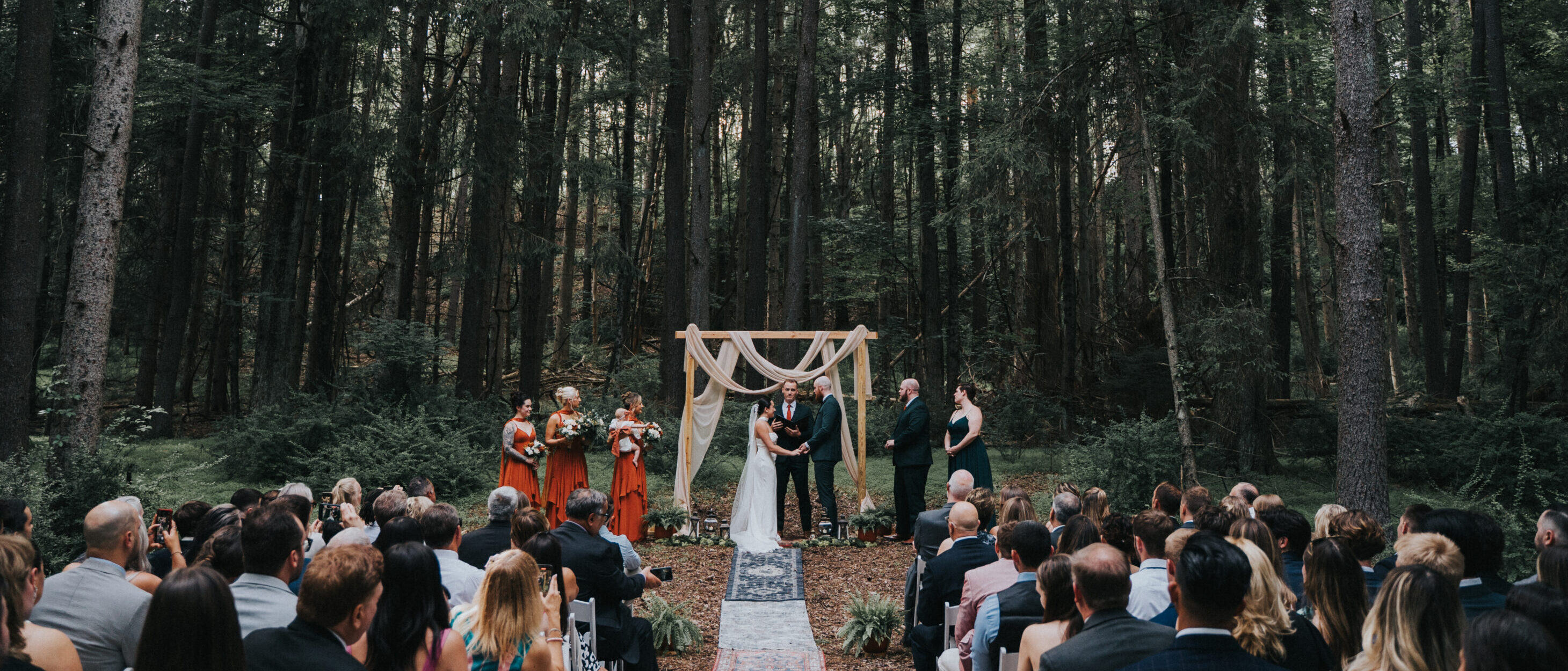 Couple kissing in barn at lakefront wedding venue in the Poconos Mountains