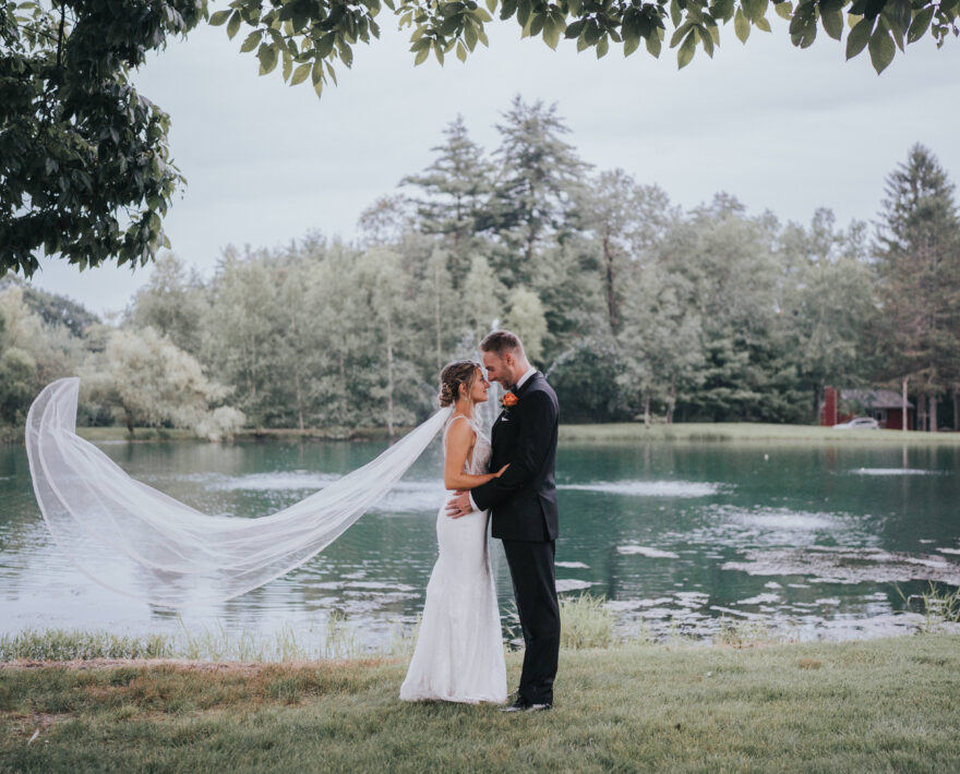 Bride and groom under veil at Grange Valley wedding venue in the Poconos