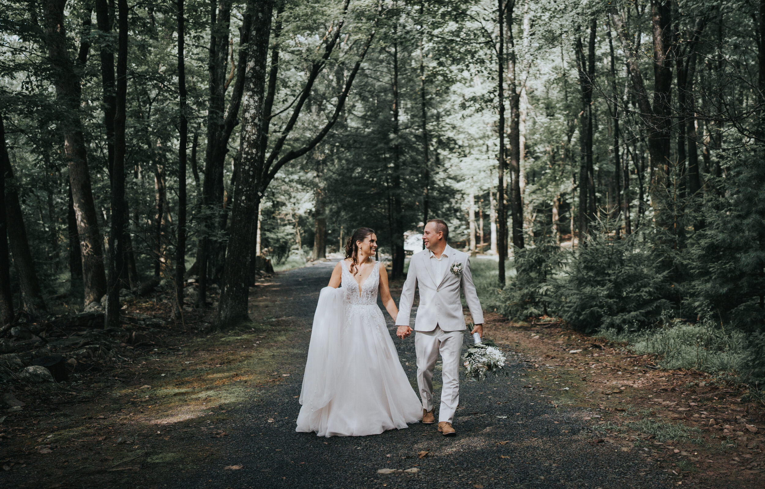 Couple getting married by a lake in the Poconos mountains