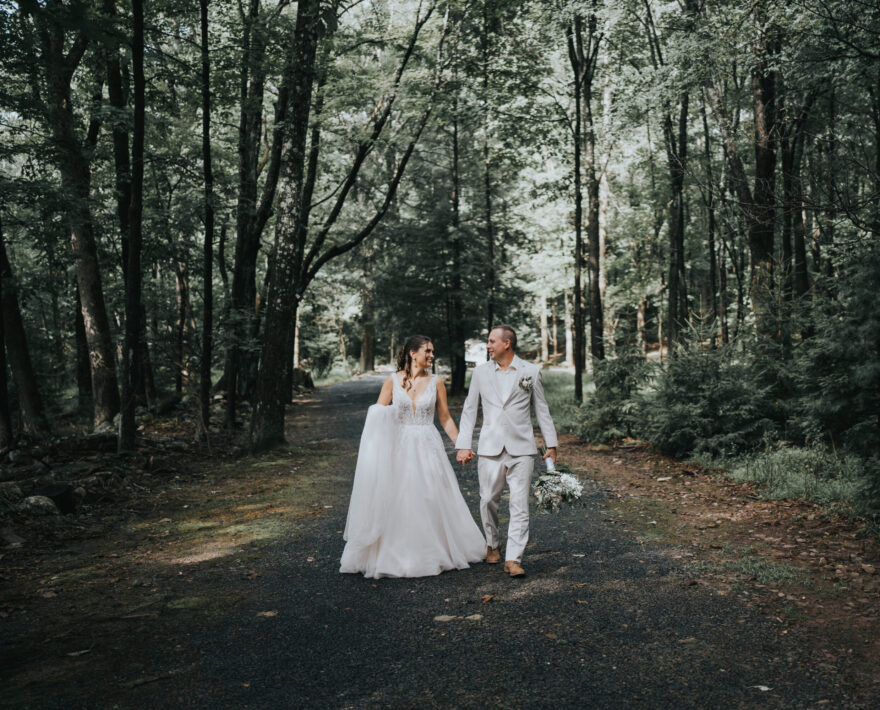 Couple getting married by a lake in the Poconos mountains