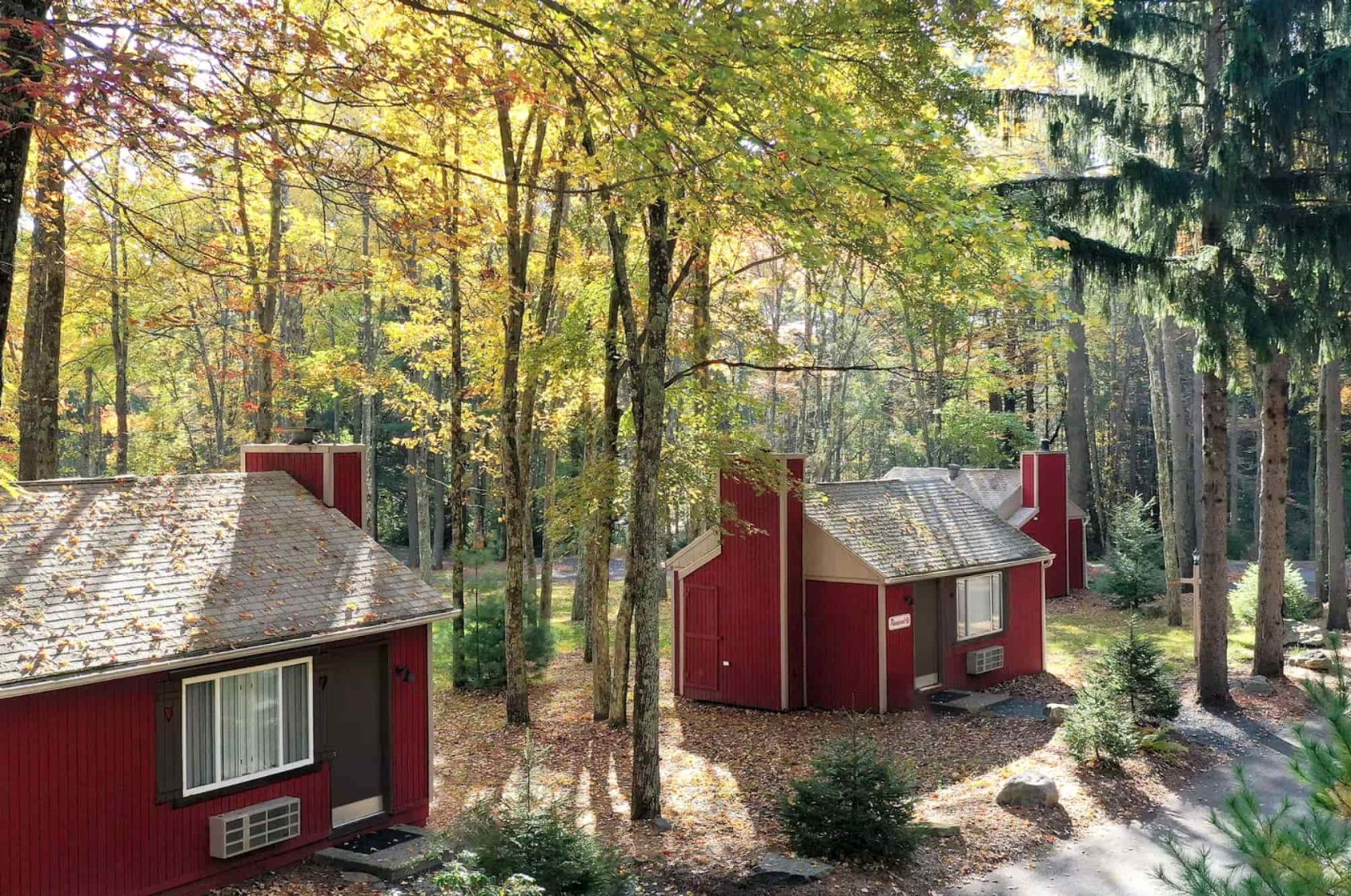 red cabins in forest setting at hotel resort in the Poconos