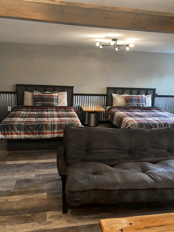 2 queen beds and futon in suite at Poconos hotel for families