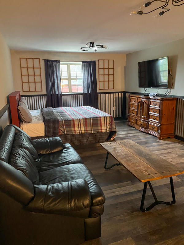 king bed in suite at grange valley in poconos