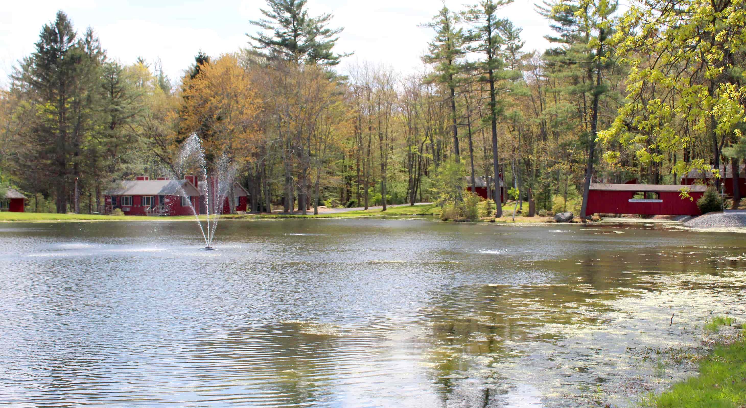 Lake view of red cottages at Mount Pocono, PA inn