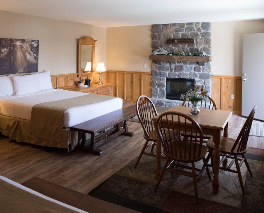 Stone fireplace in rustic guest room at Mount Pocono Inn