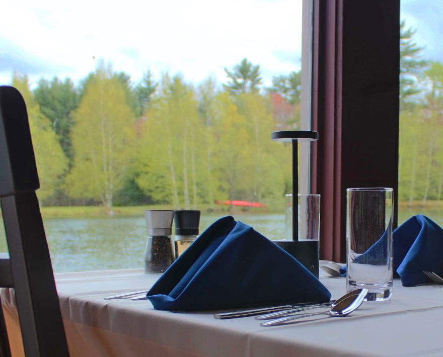 Romantic table for two at restaurant in the Poconos with water view