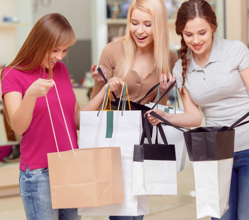 Three women shopping at premium outlets in the Poconos