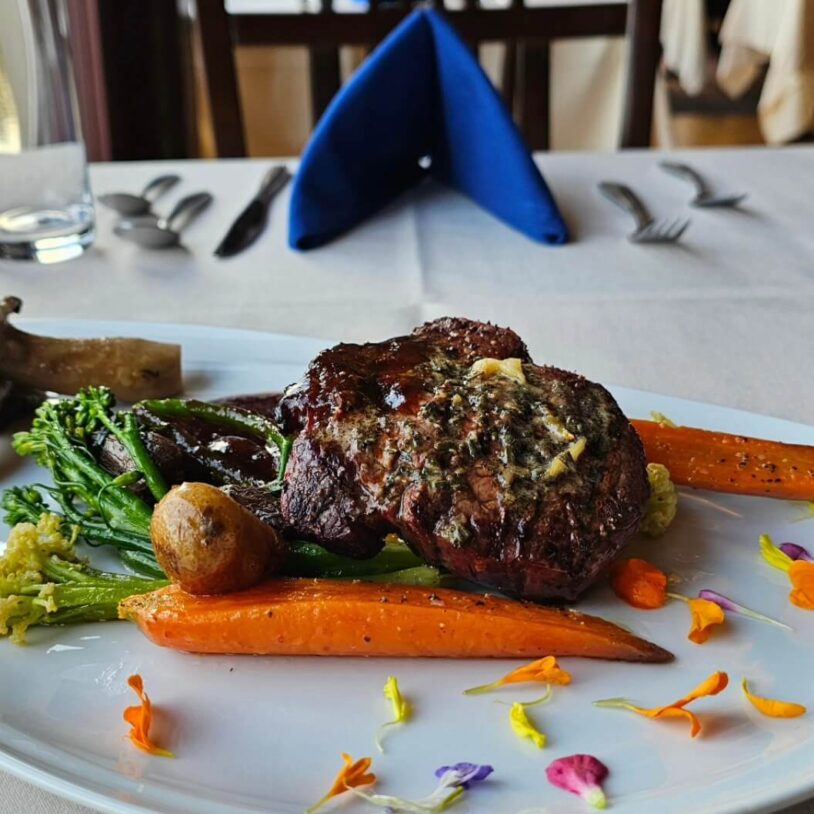 Steak and carrots with view of lake in Mount Pocono, PA
