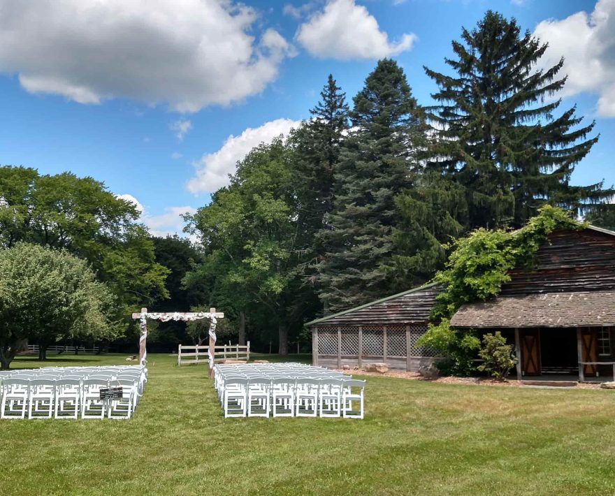 Rustic barn for weddings in the Poconos with chairs and arbor