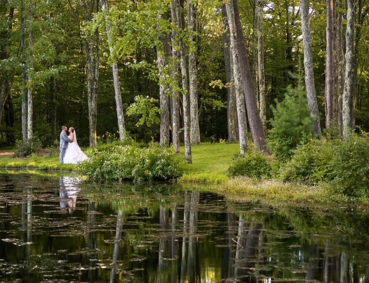 Bride and groom on lake in the Poconos, PA
