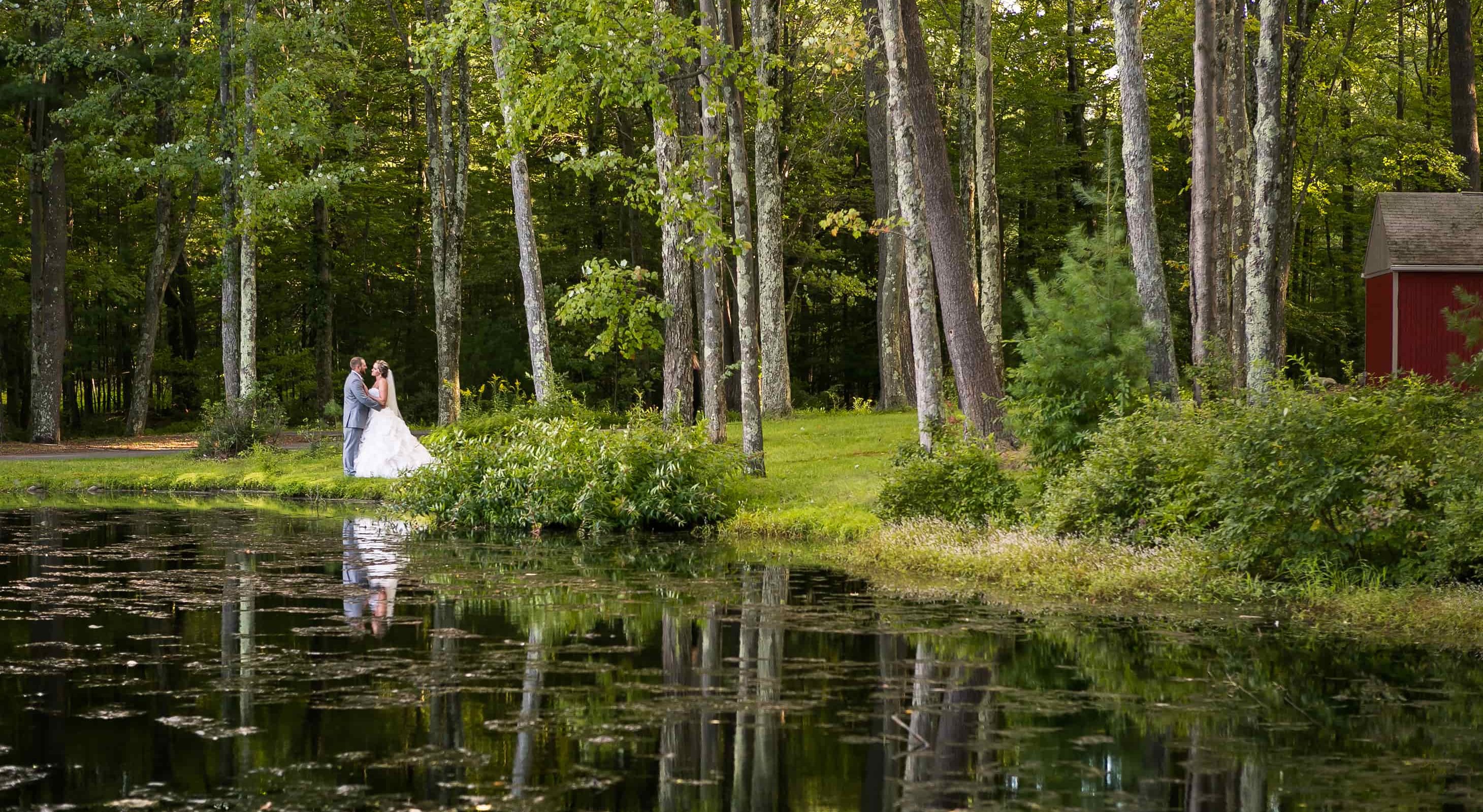 Bride and groom on lake at hotel in the Poconos, PA