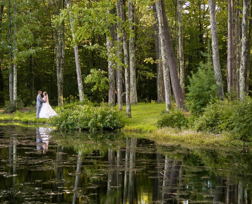 Bride and groom on lake in the Poconos, PA