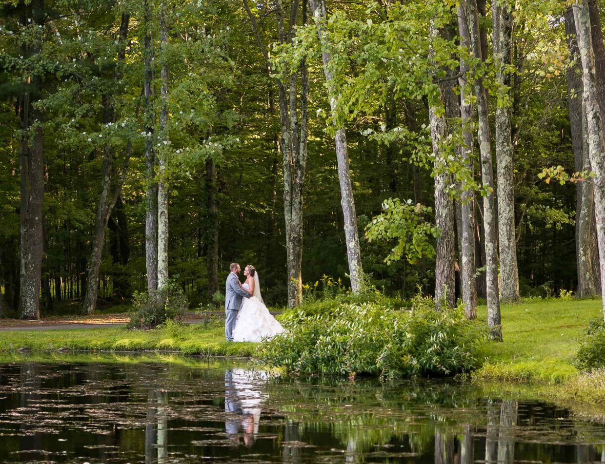 Bride and groom on lake in the Poconos, PA
