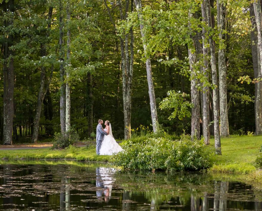Bride and groom on lake in the Poconos, PA