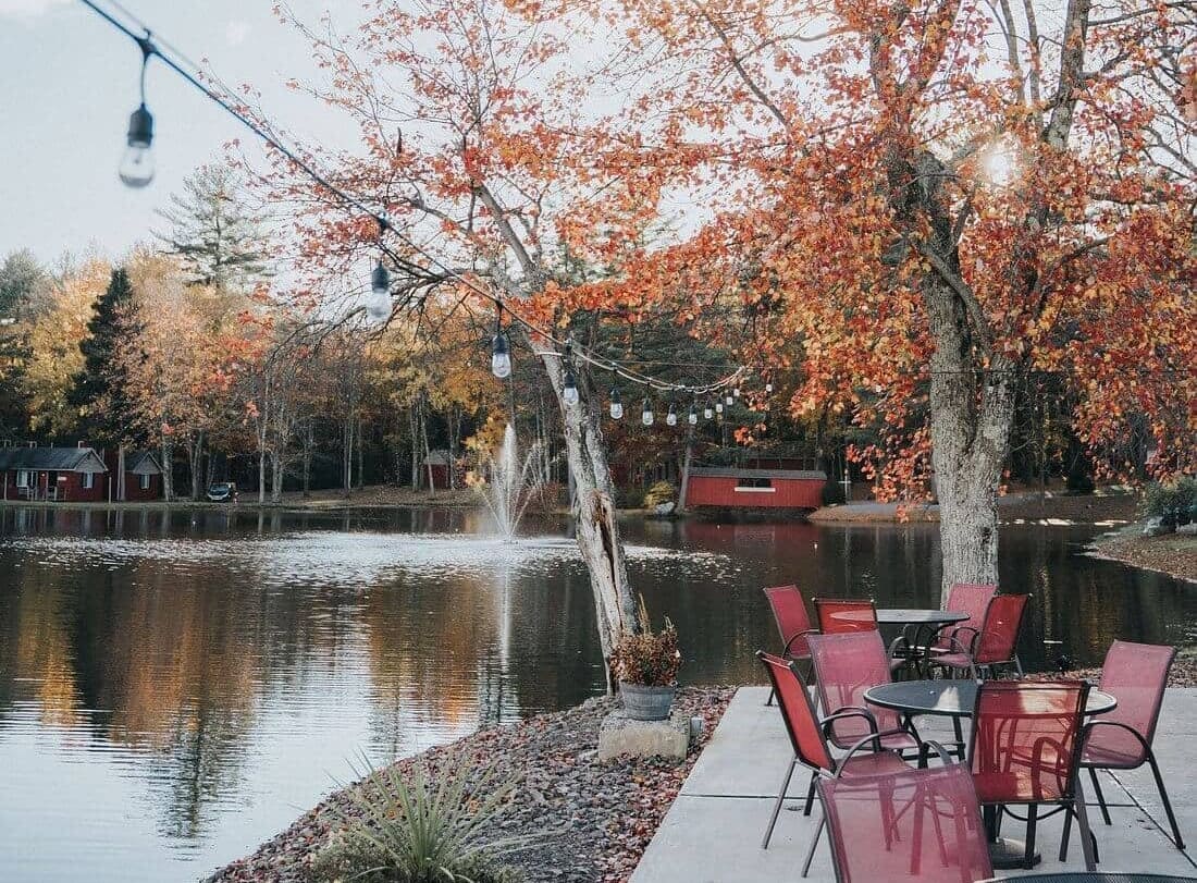 lakeside patio restaurant with lights and water views