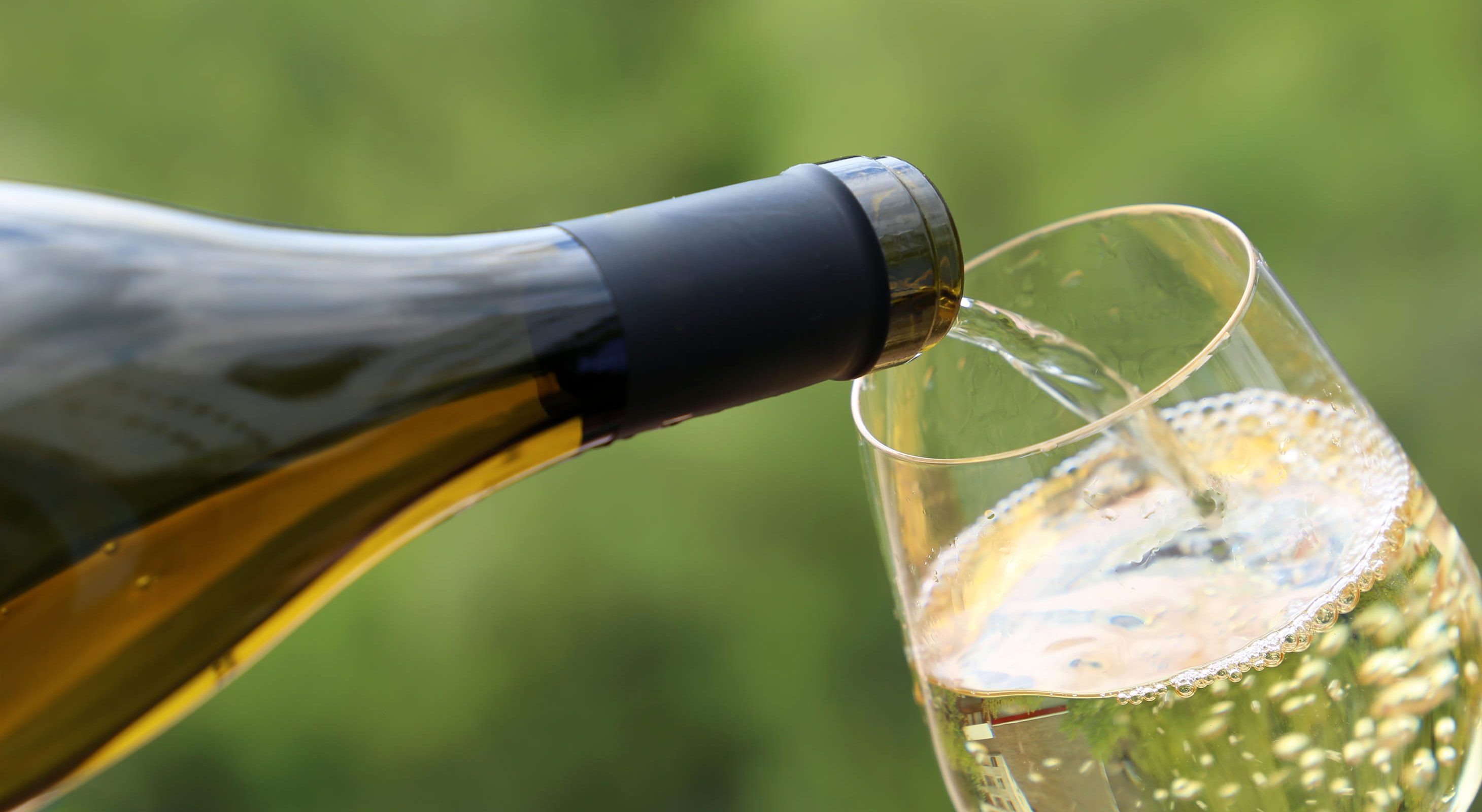 White wine pouring into glass at Poconos event