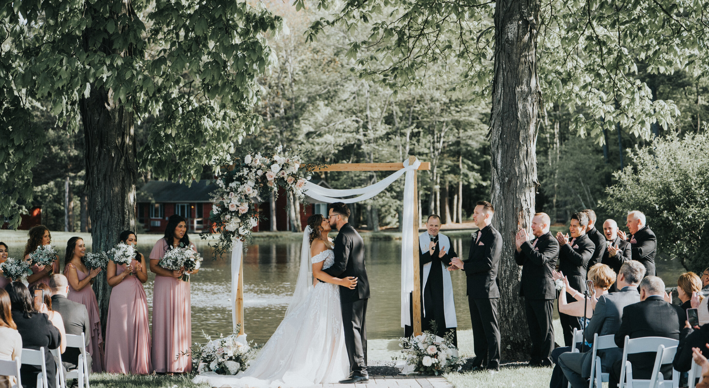 Couple kissing in barn at mountains wedding venue in the Poconos
