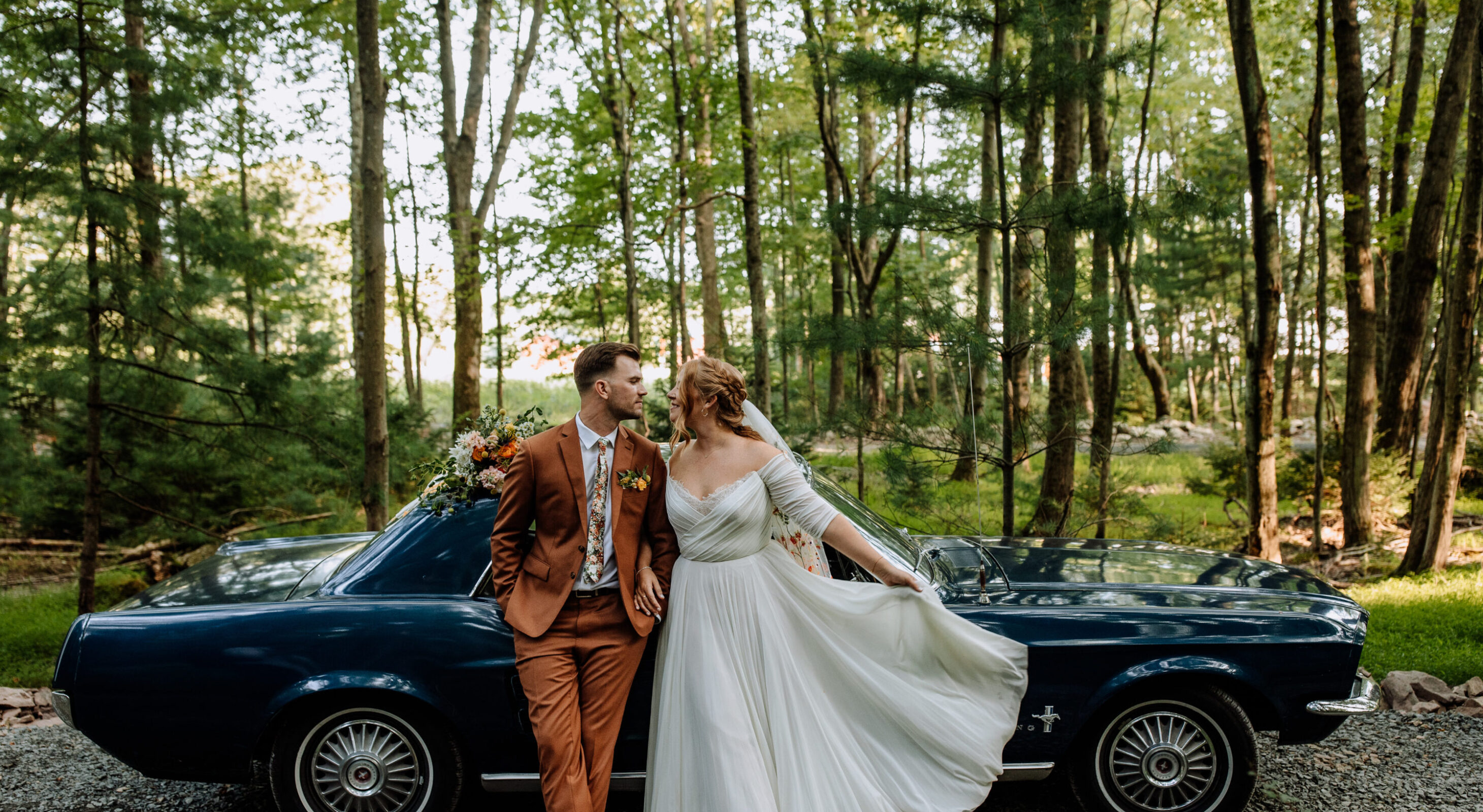 Couple kissing in barn at lakefront wedding venue in the Poconos Mountains